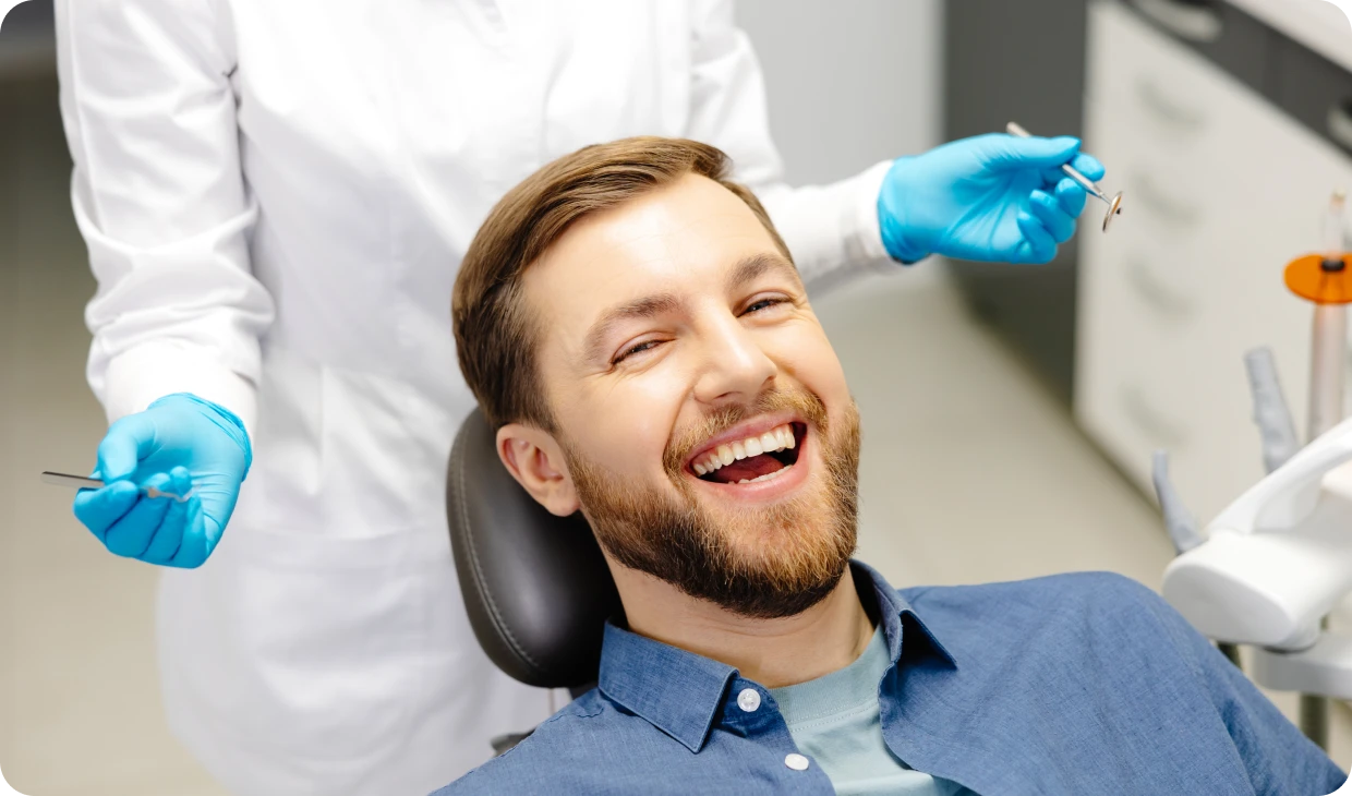 Dentist with patient in clinic