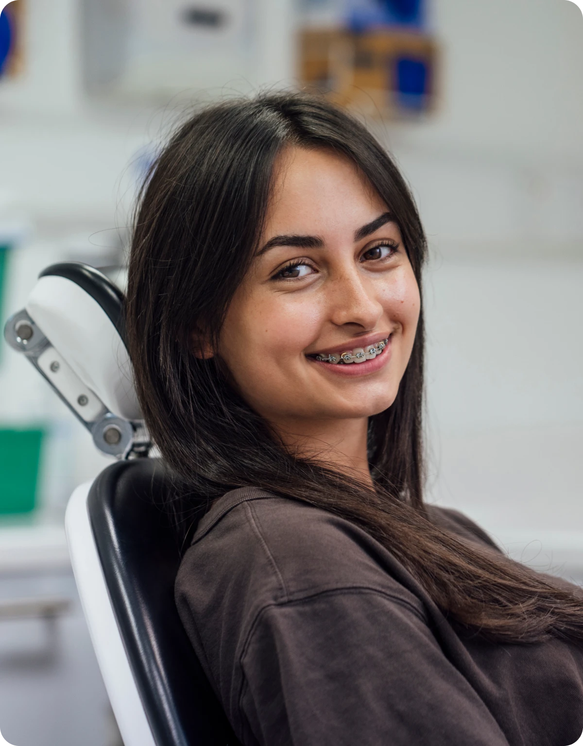 Happy young woman at the dentist.