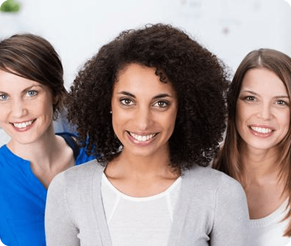 Smiling women posing together indoors